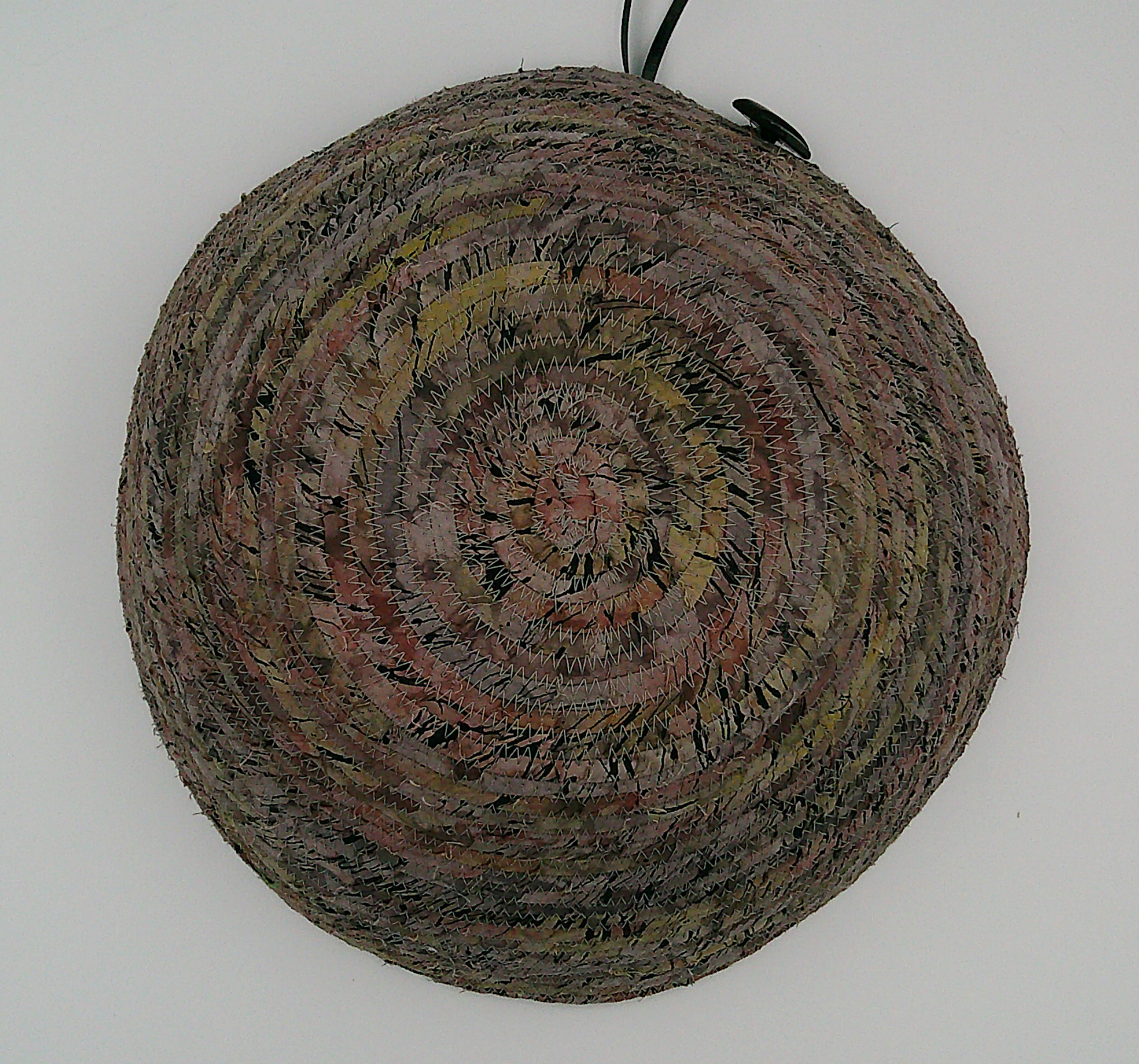 This is looking straight down at the bowl turned upside down. You can see the button and the ribbon at the bottom. This is looking straight down at the bowl turned upside down. You can see the button and the ribbon at the bottom.